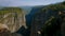 View of the Canyon with large mountains and the river.