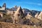 View on Cappadocia rock houses, caves and ruins in Goreme in Anatolia, Turkey. Ruins of an ancient city. The concept of the