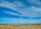 View from the car to a great wind turbines for produce electricity