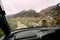 View From Car Window On Old Abandoned Village With Ruined Houses