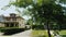 View from a car window to a typical American street, houses and well-groomed territory