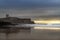 View of the Carcavelos Beach with the Sao Juliao da Barra Fort on the background at sunrise