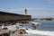 View from Carneiro beach in Porto to pier and lighthouse Felgueiras