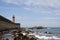 View from Carneiro beach in Porto to pier and lighthouse Felgueiras