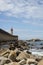 View from Carneiro beach in Porto to pier and lighthouse Felgueiras