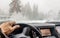View through the cars windshield in the winter snowy day on the