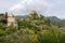 View of Castello Brown, 16th century museum in Portofino in Italy. Trees and greenery around the historic building