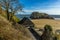 A view from the Castle Hill gardens towards Saint Catherine`s Island in Tenby at low tide