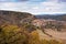 View of castle and Pelegrina village surrounded by a beautiful autumn landscape with colorful trees in Barranco del Rio Dulce