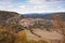 View of castle and Pelegrina village surrounded by a beautiful autumn landscape with colorful trees in Barranco del Rio Dulce