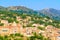 View of Cateri village with stone houses built in traditional Corsican style on top of a hill, Corsica island, France