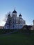 View of the Cathedral of the Holy Prince Alexander Nevsky against the blue sky and the Commandant`s Garden