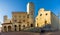 View at the Cathedral of Santa Maria Assunta with Town hall building at the Place of Duomo in San Gimignano, Italy