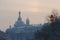 View of the Cathedral of the Savior on Spilled Blood at sunset through the trees of the Field of Mars