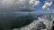 A view of Cayman Islands from a boat off the shore of Rum Point with a storm on the horizon