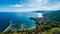 View of Cefalu and Promontorio de Torre Caldura seen from Norman Castle, La Rocca park, Sicily island, Italy