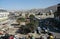 A view of central Kabul, Afghanistan showing the market, traffic, crowds of people and distant hills.