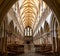 View of the central nave and altar inside the historic Wells Cathedral in Somerset