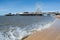 View on the Central pier with amusement park and splashing waves of stairs, sunny spring, west english coast, Blackpool, England