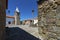 View of the central square of the historic village of Castelo Mendo, in Portugal, with a church and pillory