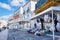 View of the central street and square with traditional shops at picturesque seaside village Nazare