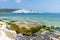 A view of chalk boulders by the waters edge at Hope Gap, Seaford, UK