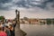 view of Charles bridge in Prague with tourists and musicians