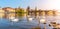 View on Charles bridge and Swans on Vltava river in Prague at sunset, Czech Republic