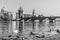 View on Charles bridge and Swans on Vltava river in Prague at sunset, Czech Republic