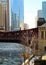 View of a Chicago bridge and bridgehouse on an ice chunk covered, frozen Chicago River.