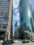 View of Chicago Loop at the corner of Wacker/Franklin durin rush hour, including cars, bicycles, el train