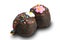 View of choc balls or chocolate balls topping with multicolored rainbow sprinkles and colored sugar flower on white background.