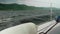 View of choppy water of reservoir from yacht cockpit.