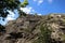 View of a Christian cross placed on top of a rock