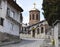 View of the church in the city of Ohrid while walking along the cozy streets with stone pavements near the city center, North