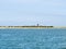 View of church of Hollum and coast of Ameland island in Waddensea, Friesland, Netherlands