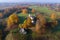 View of the Church of St. George, golden autumn aerial survey. Trigorskoe. Pushkin Mountains, Rus