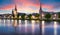 The view of the churches of Inverness on the Ness River, Scotland, UK at dramatic sunrise with reflection in water