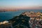 View of the city from above, the statue of Christ on the banks of the Tagus River, narrow streets and roofs of houses with red til