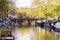 View on the city of Amsterdam, capital of the Netherlands. Canals and canalboats, trees and water