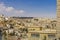 View of the city of Bethlehem from the hill, urban buildings, against the sky and clouds