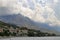 View of the city of Brela and the mountains with beautiful cumulonimbus clouds, Makarska rivera, Dalmatia, Croatia