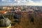 View of the city and city streets, architecture and roofs houses from above. Prague