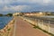 View on city and dam in lagoon Orbetello on peninsula Argentario. Italy