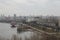 View of the city and the Dnieper River. Autumn landscape of the city from a high roof. Sights and architects of a big city.