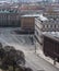 View of the city in early spring. Facades and roofs of buildings, empty street