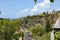 The view of the city from the fortress in Old Bar, Montenegro. Houses with red roofs, olive trees and cypress tr