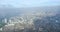 A view of the city of Manila through the window from the plane. Impressed photo of a tourist in flight over the capital