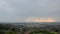 View of the city from the mountain with stormy, rain clouds