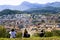 A view of the city of Olot and the Garrocha volcanic park from the top of the Montsakopa volcano. The family rests after hiking